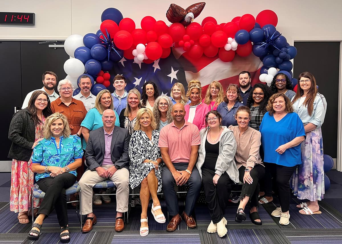 The MWG Broker Services team gathered for a group photo during a OneAmerica visit.